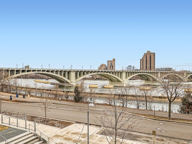 view of property featuring a water view and a city view