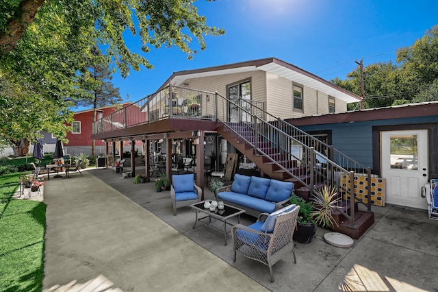 back of house with a patio and an outdoor hangout area