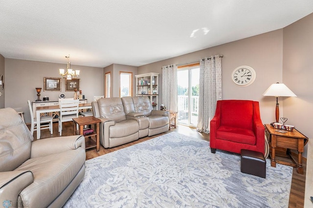 living room featuring a notable chandelier and hardwood / wood-style flooring