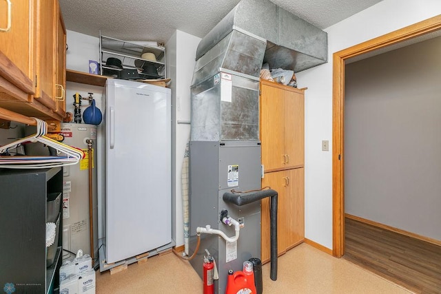 utility room with water heater