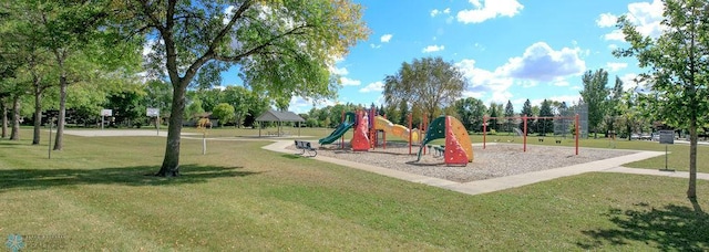 view of playground with a lawn