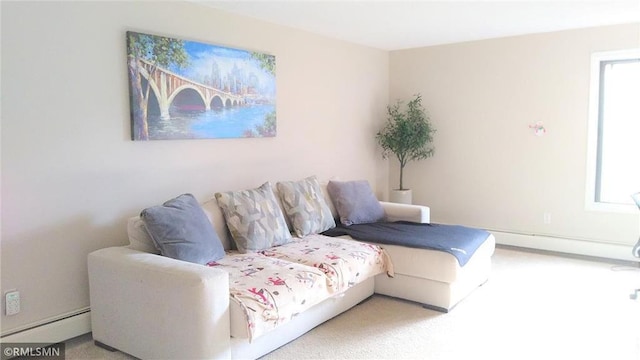 living room with a baseboard radiator and carpet