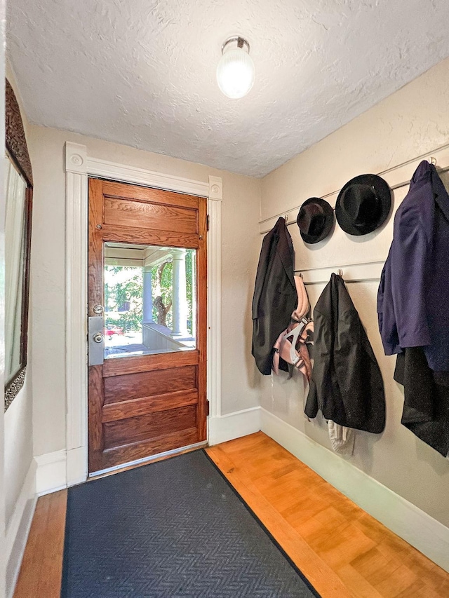 3017 James Ave S, Minneapolis, MN 55408 - mudroom with a textured ceiling and wood finished floors
