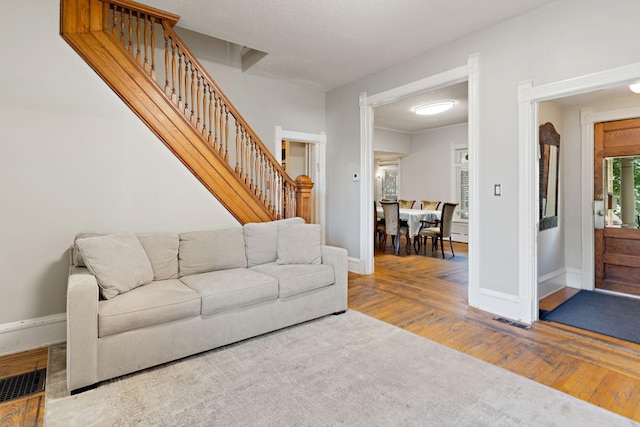 3017 James Ave S, Minneapolis, MN 55408 - living area with wood finished floors and stairway