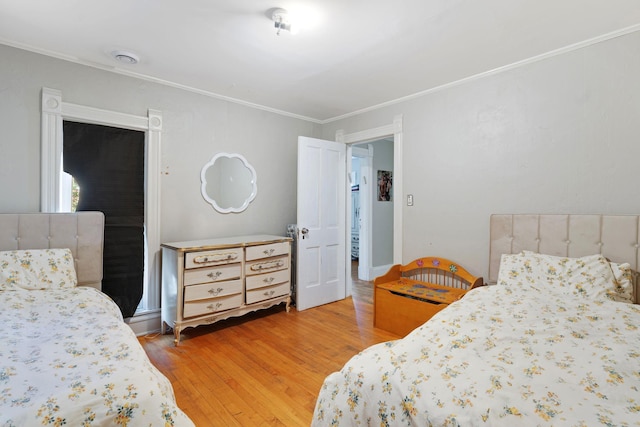 3017 James Ave S, Minneapolis, MN 55408 - bedroom featuring light wood finished floors and ornamental molding