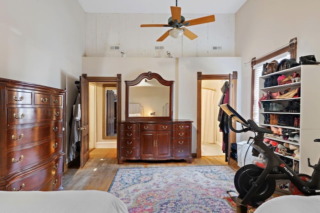 3017 James Ave S, Minneapolis, MN 55408 - bedroom featuring a high ceiling, light wood-type flooring, and ensuite bath