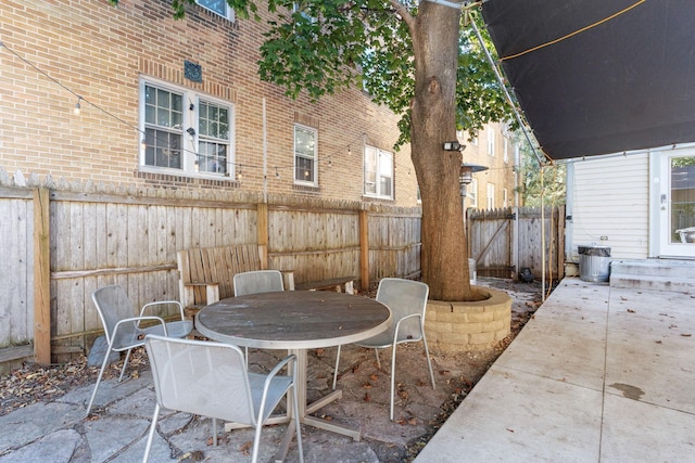 3017 James Ave S, Minneapolis, MN 55408 - fenced backyard with a patio area and outdoor dining area