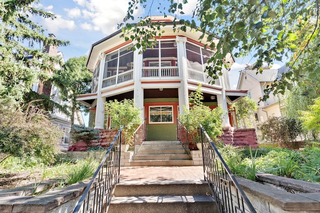 view of front of home with a sunroom