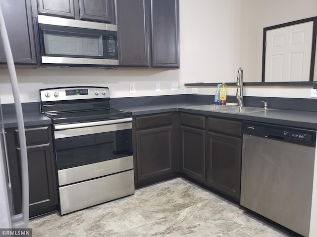 kitchen with appliances with stainless steel finishes and sink