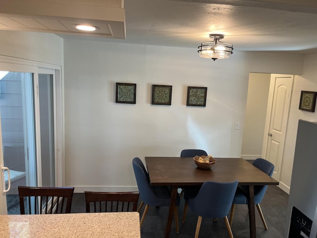 dining area with a textured ceiling