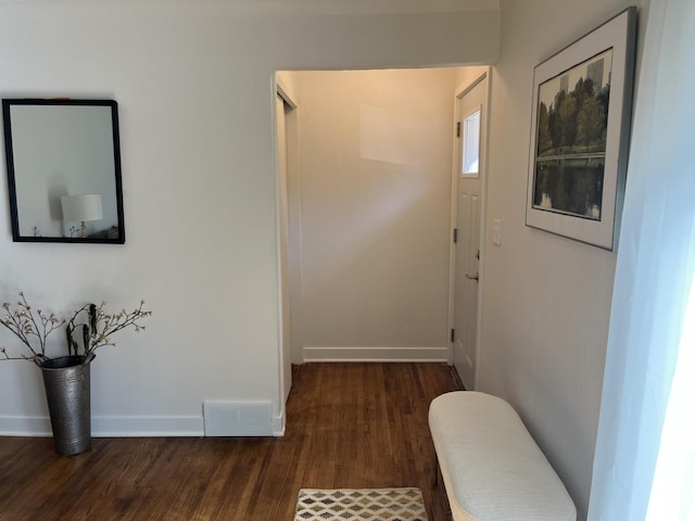 hallway featuring dark hardwood / wood-style floors