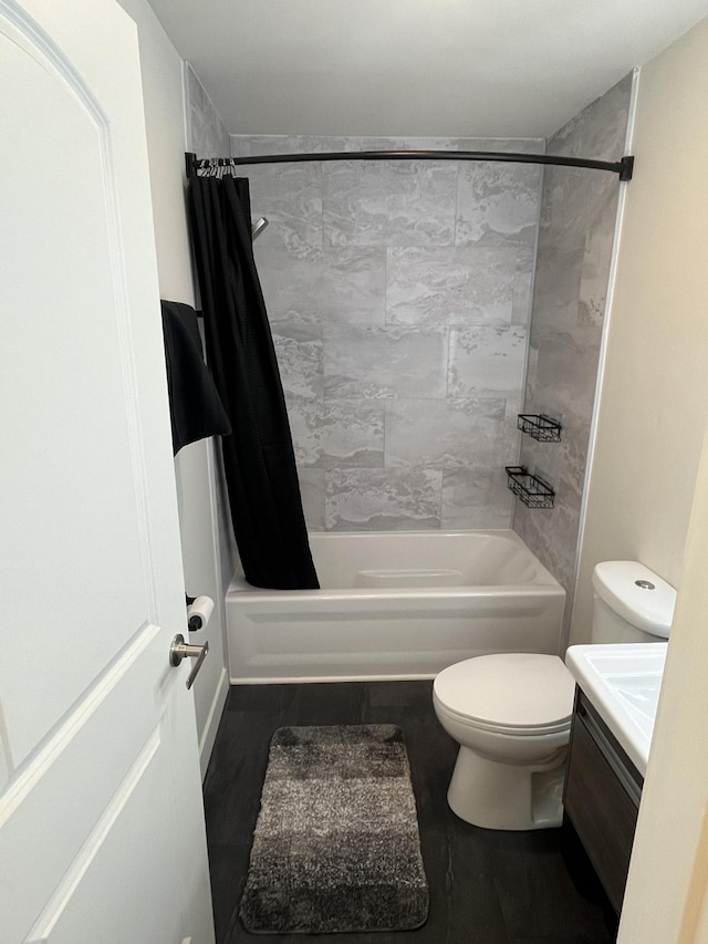 full bathroom with toilet, shower / tub combo with curtain, and vanity