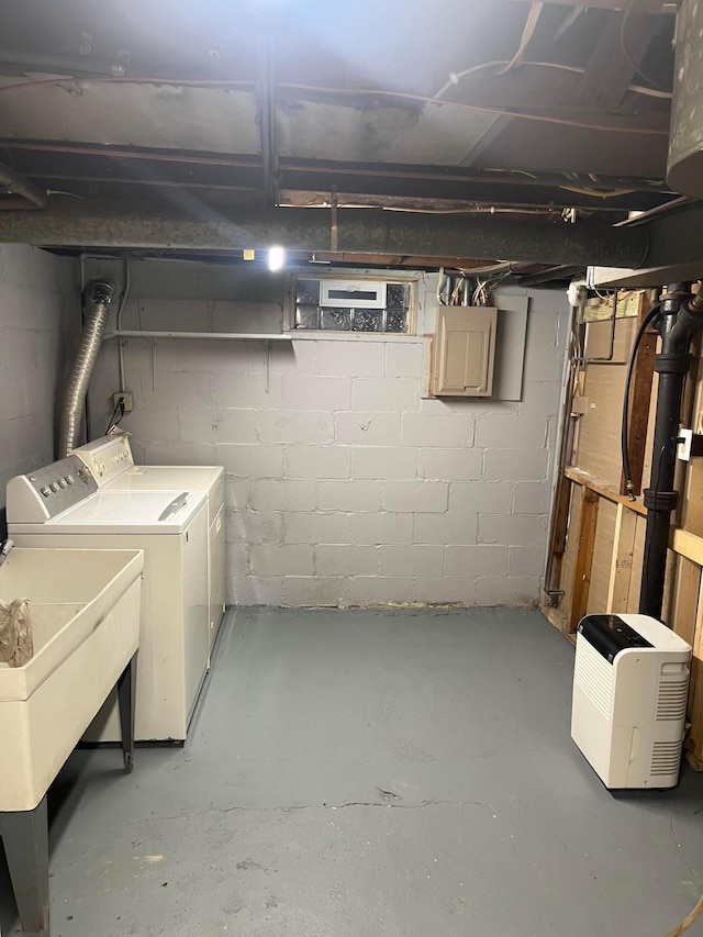 basement with washing machine and clothes dryer