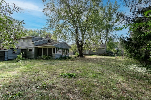 view of yard with a sunroom