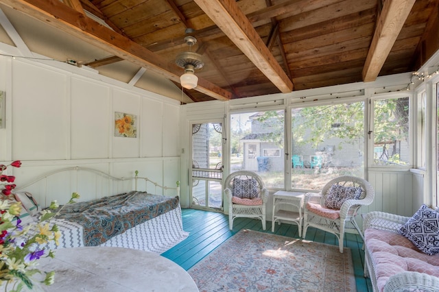 sunroom with wood ceiling, vaulted ceiling with beams, and ceiling fan