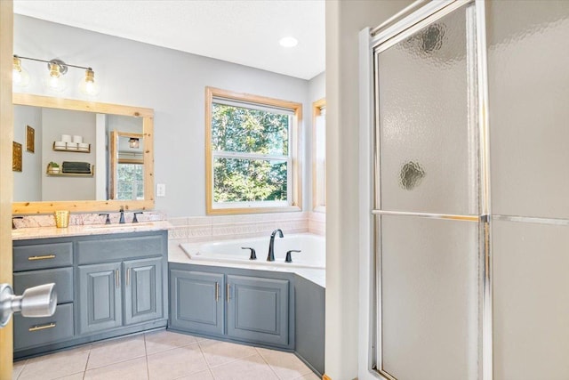 bathroom featuring vanity, plus walk in shower, and tile patterned floors