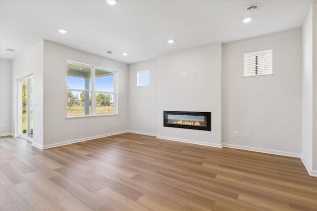 unfurnished living room featuring light hardwood / wood-style flooring