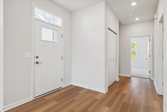 foyer entrance with light hardwood / wood-style flooring