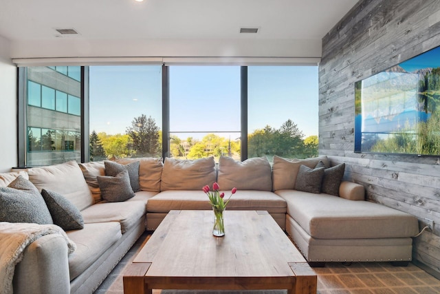 living room with wood walls