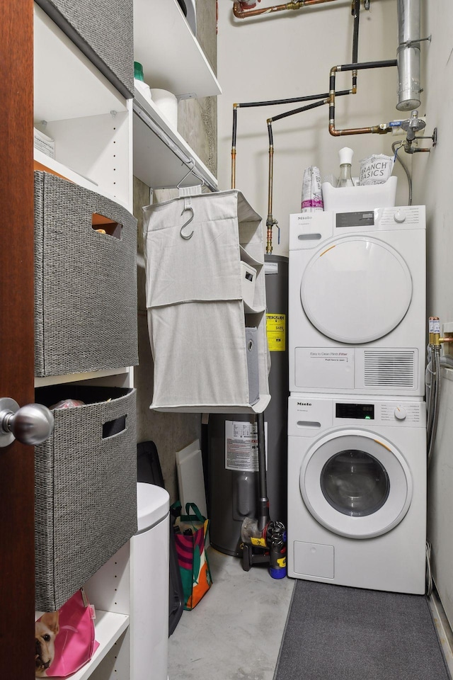 laundry room with stacked washing maching and dryer