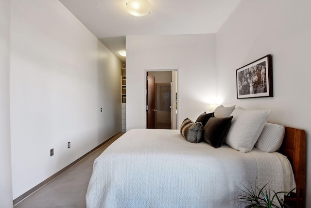 bedroom featuring connected bathroom and carpet floors