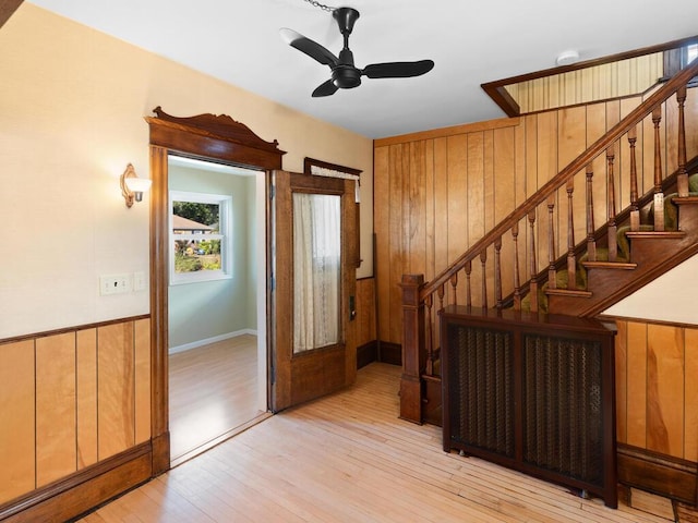 foyer entrance featuring light wood-type flooring and ceiling fan