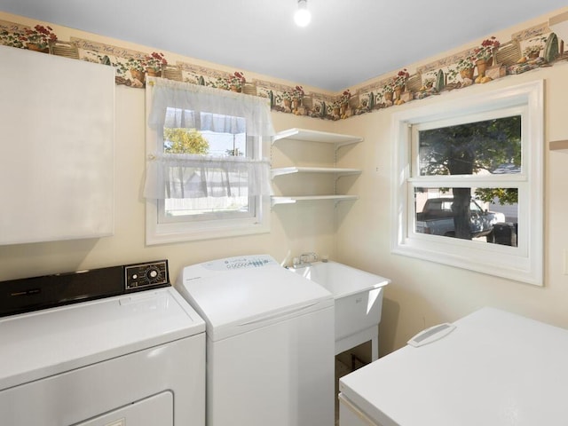 laundry area with separate washer and dryer