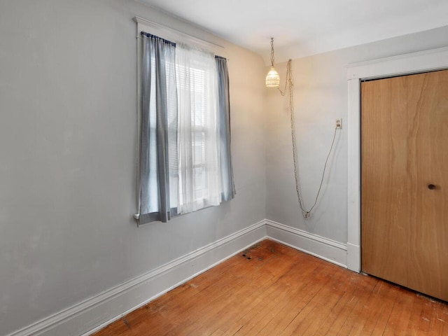 spare room featuring hardwood / wood-style flooring