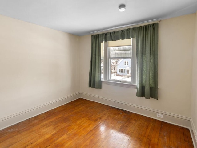 spare room featuring hardwood / wood-style flooring