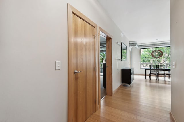 hallway with light wood-type flooring