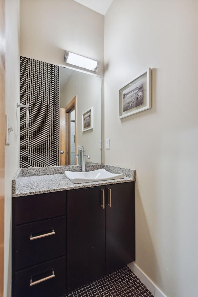 bathroom with tile patterned floors and vanity