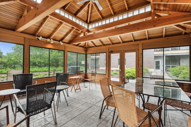 sunroom featuring wooden ceiling, lofted ceiling with beams, and ceiling fan