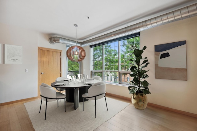 dining area with light wood-type flooring