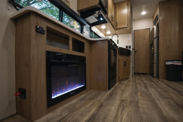 kitchen with wood-type flooring