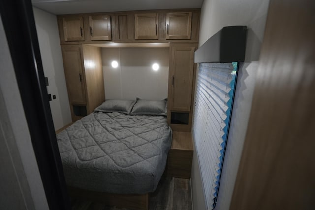 bedroom featuring hardwood / wood-style flooring