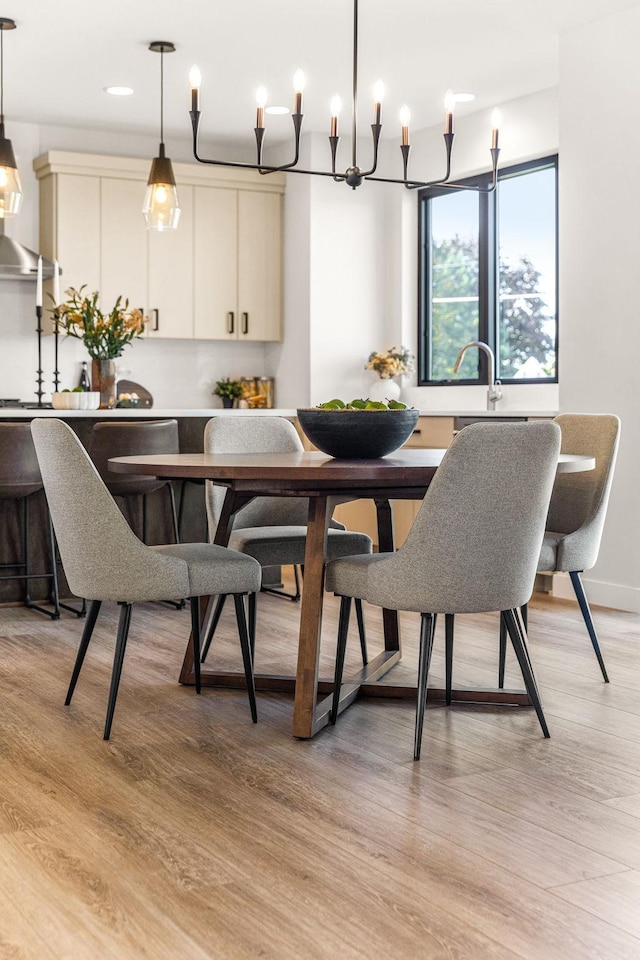 dining area with light hardwood / wood-style floors