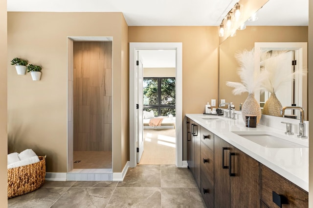 bathroom featuring vanity and a tile shower