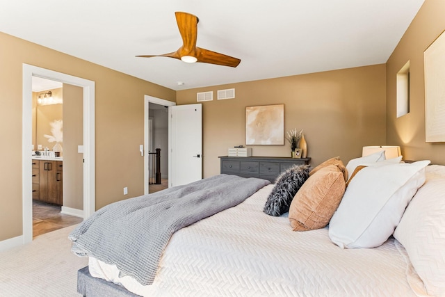 bedroom with baseboards, visible vents, a ceiling fan, and light colored carpet