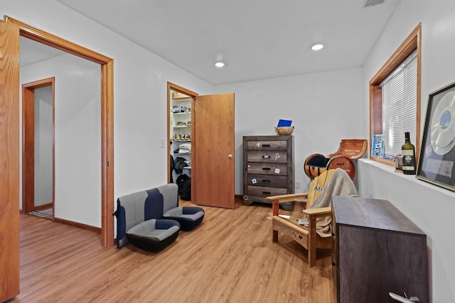 sitting room featuring recessed lighting, visible vents, baseboards, and light wood finished floors