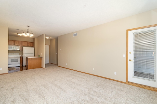 unfurnished living room with light colored carpet and a notable chandelier