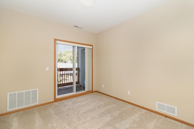 spare room featuring carpet flooring