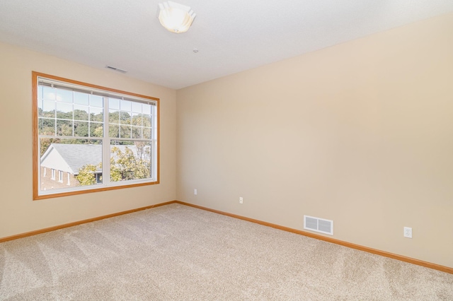 empty room with carpet flooring