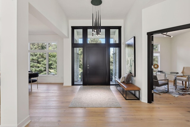 entryway featuring light wood-type flooring and baseboards
