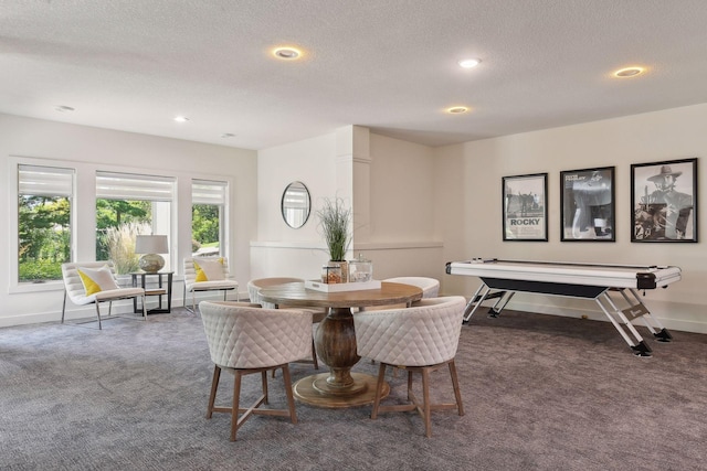 carpeted dining area featuring a textured ceiling, baseboards, and recessed lighting