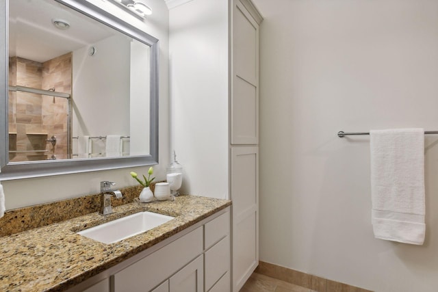 bathroom featuring vanity and a shower stall