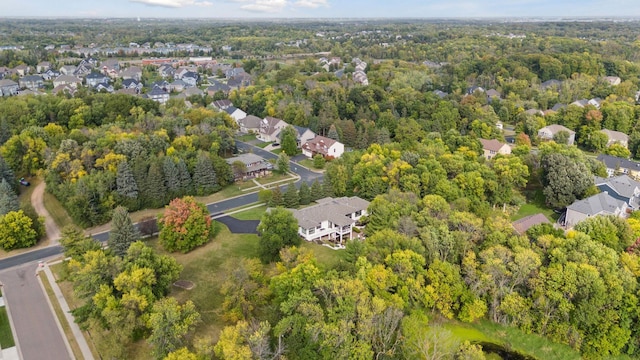 aerial view with a residential view and a view of trees