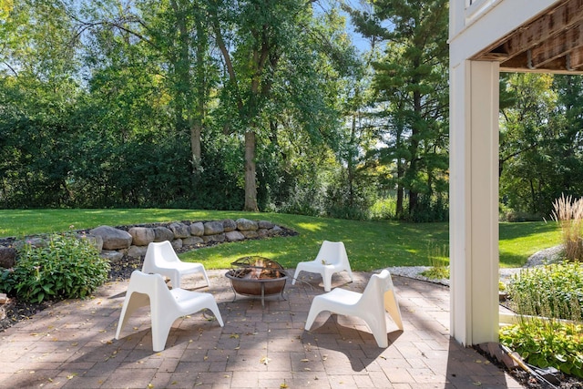 view of patio / terrace with an outdoor fire pit