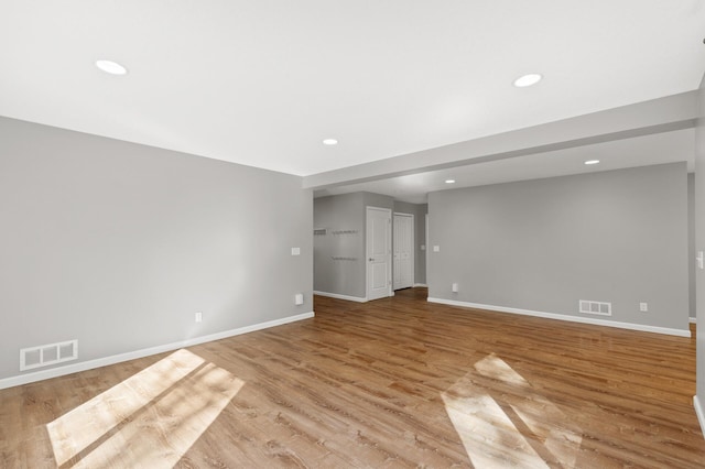 spare room with light hardwood / wood-style floors