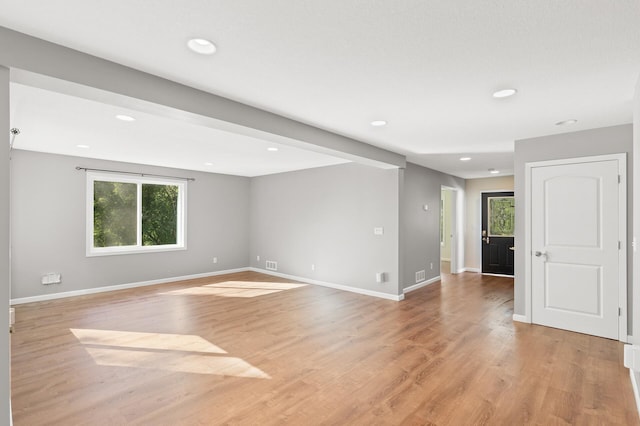 spare room featuring light hardwood / wood-style flooring