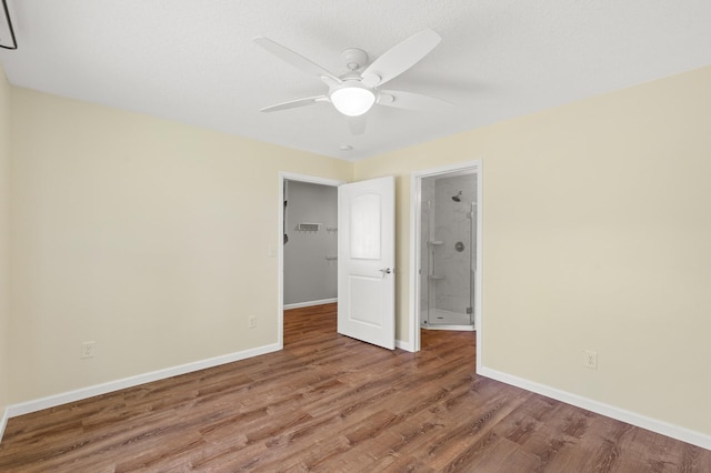 unfurnished room with ceiling fan and hardwood / wood-style flooring